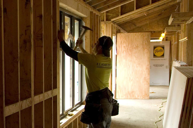 Man building house interior