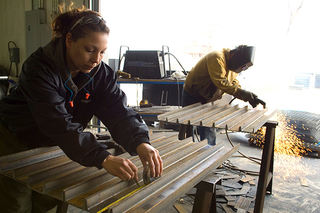 Two welders in the shop