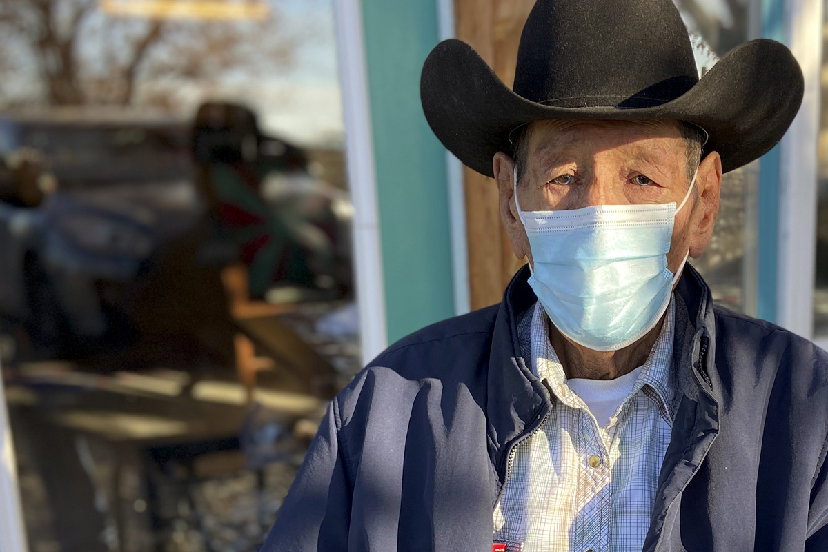 Native man wearing a face mask