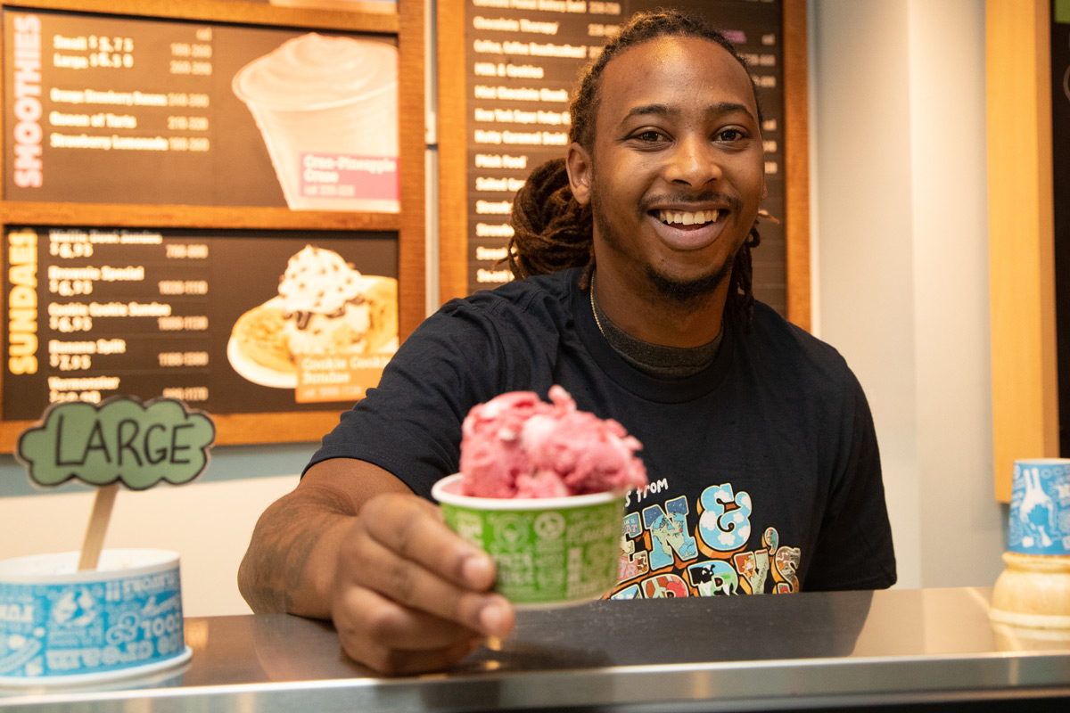 Young man serving ice cream at a Baskin & Robbins