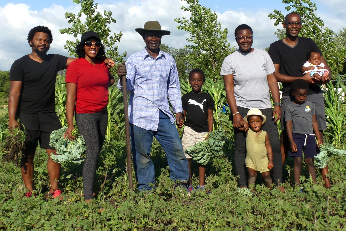 Sharing Our Roots farmer, Elkana Abobo (center) and family