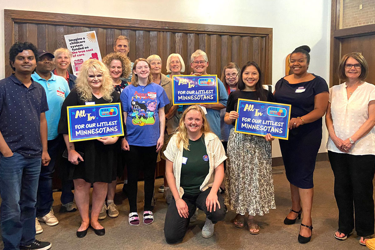 Lydia Boerboom, KCOU lead organizer (kneeling front) with KCOU supporters