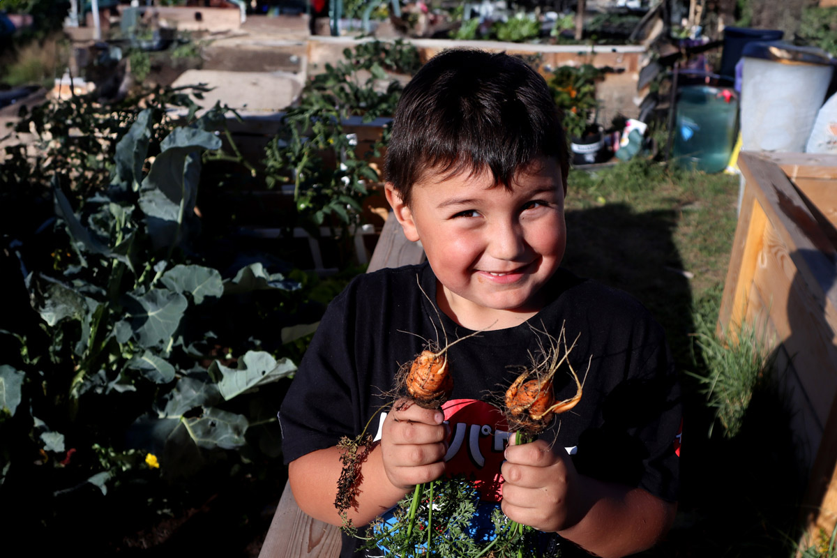 FAST Blackfeet youth at his family's garden plot